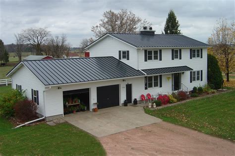 white house with charcoal gray metal roof|grey metal roof colors.